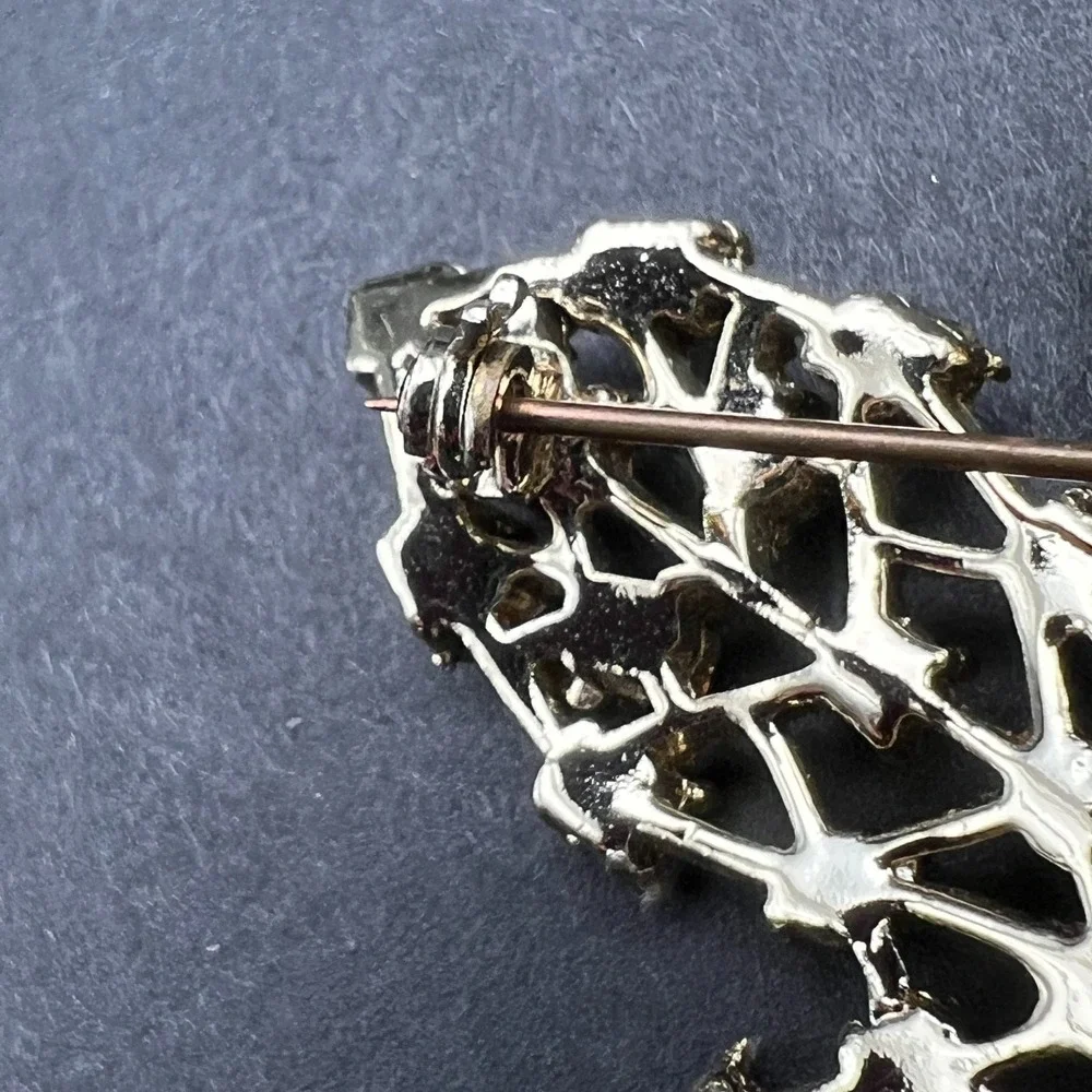 Gold Tone Leaf Brooch Red Rhinestone Accents Textured Openwork Vintage Style Pin